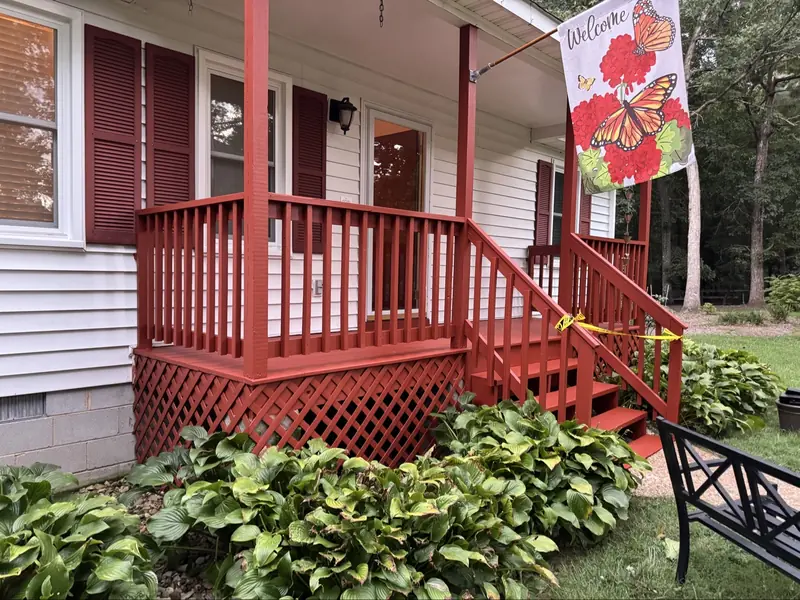 Freshly painted porch with railings and steps